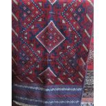 Meshwari runner, with geometric medallion decoration in red and blue, 250 x 60cm