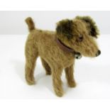 Vintage straw filled dog in standing pose