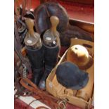 A collection of saddlery and equine related items comprising a leather saddle, pair of ladies riding