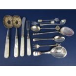A quantity of novelty sterling English silver spoons to include a caddy spoon, an interesting