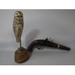 Reproduction flint lock pistol with brass mounts, 40cm long; together with a folk art decoy bird