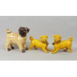 Ceramic figure of a Pug dog and a pair of Chinese yellow ground Pugs, 70 cm and smaller
