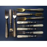 Eleven various silver handled or collared fruit/cake knives