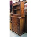 A reproduction Georgian style yew wood veneered chest of six long graduated drawers raised on ogee