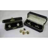 Pair of 18ct cufflinks, 5.3g, together with a further silver and mother of pearl pair and a