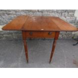 A Regency mahogany Pembroke table fitted with the usual arrangement of one real and one dummy drawer