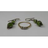 18ct three stone diamond ring, size K, 1.2g and a pair of green gem set silver drop earrings (3)