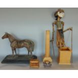 A leather cased bone handled dressing set, together with a spelter bronzed model of a standing