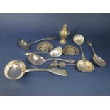 A good collection of interesting silver spoons comprising scallop shell caddy spoon, further caddy