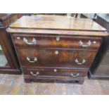 A 19th century continental commode of three long drawers with shaped outline, cast brass fittings,