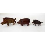 A cold painted bronze figure of a wild boar, another, probably in brass and a timber example with