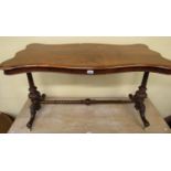 A Victorian walnut and figured walnut centre table of rectangular form with serpentine outline