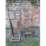 A vintage heavy duty sack truck with ashwood shafts and square through jointed splats, cast iron