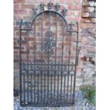 A good quality heavy gauge side/pedestrian gate of stepped arched form with fleur-de-lys finials and