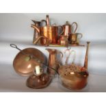 A collection of various copper wares to include a watering can, various jugs, night lanterns, etc (a