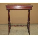 A 19th century mahogany occasional table of rectangular form with moulded outline raised on a pair
