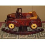 A wooden child's rocking toy vintage bull nose Morris soft top motor car