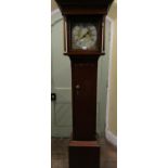 A Georgian oak longcase clock, the square cut hood enclosing a 28cm square dial, in brass with