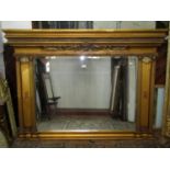 A contemporary reproduction Regency style overmantle mirror with bevelled edge rectangular plate