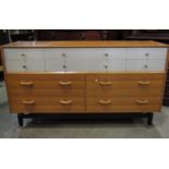 An Gomme G plan Le Brenza oak dresser fitted with an arrangement of ten drawers, the upper with