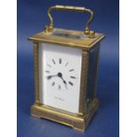 Engine turned brass cased carriage clock by K J Bradford, 11cm high