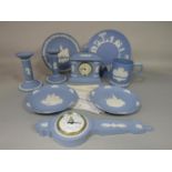 A collection of Wedgwood blue ground Jasperwares including a barometer, a mantle clock and a pair of