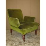 A Victorian drawing room chair with green dralon upholstered finish, unusual arm pads and raised