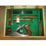 A Faithful cased portable carpentry tool kit comprising plane, square, gauge, chisel, etc