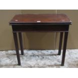A Georgian mahogany fold over top tea table of rectangular form raised on square cut and moulded