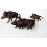 A small bronze group of five pigs (as one) and two further examples of wild boar