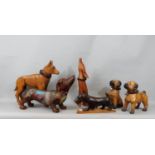 Fourteen carved timber figures of dogs, various breeds, some whimsical, 32 cm and smaller