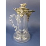 A good quality silver plate and glass claret jug, the top with hinged lid mounted by a standing