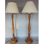 Pair of turned wooden table lamps by Jim Harries, with shades (2)