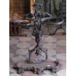 A cast iron two divisional floorstanding umbrella/stickstand with naturalistic fruiting grape and