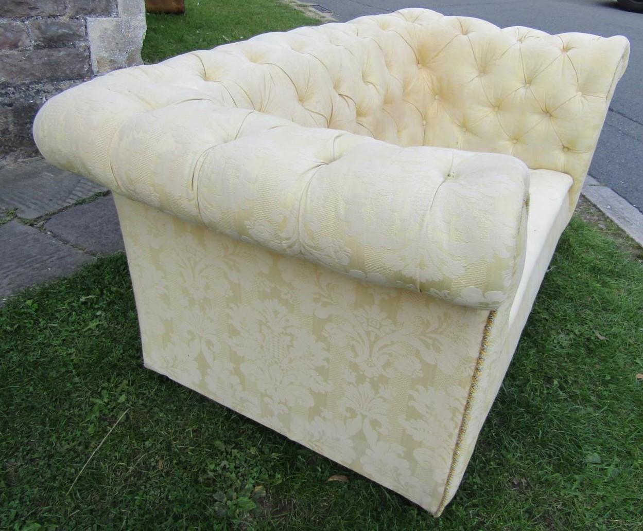 A two seat Chesterfield sofa with repeating floral pattern upholstery buttoned back and rolled arms, - Image 2 of 4