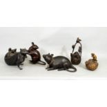 A collection of five oriental bronzes, one of a rat upon a fruit, another of rats scrabbling