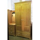A good quality contemporary maple wardrobe enclosed by a pair of three quarter length fielded