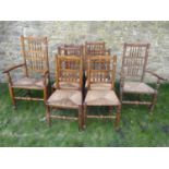 Six (4&2) Lancashire spindle back dining chairs with rush seats, turned supports and stretchers (AF)