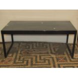 A Habitat low contemporary ebonised occasional table of rectangular form raised on square cut
