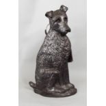 A cast iron half side companion set in the form of a terrier supporting a selection of three small
