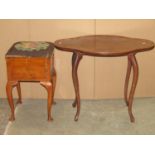 A 1920s three tier oak plant stand/occasional table on barley twist supports together with a late