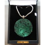 Contemporary silver and malachite pendant necklace, the substantial circular malachite panel 7.5cm