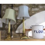 Two similar Corinthian column brass table lamps with shades, the largest 70cm high including