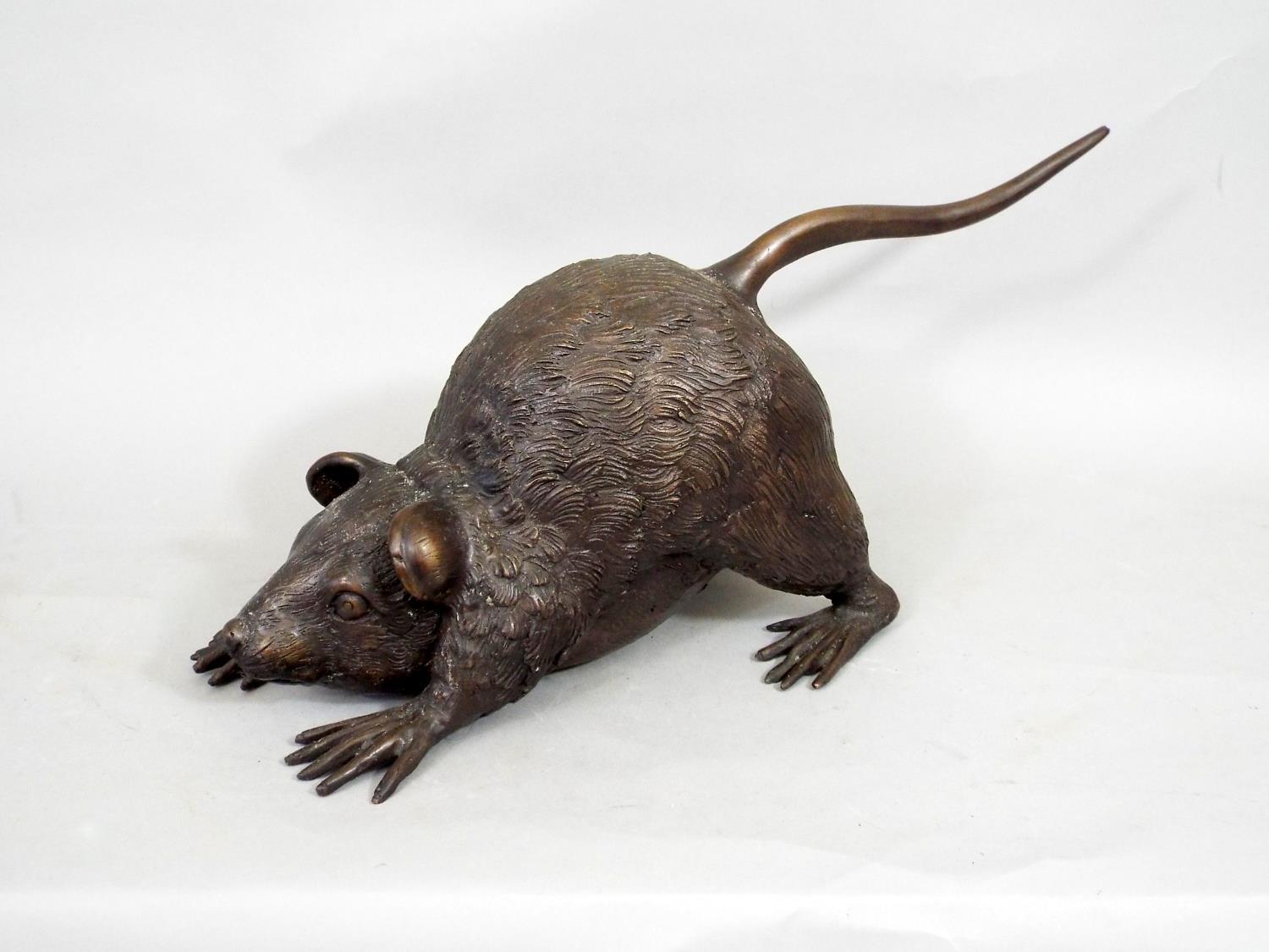 An oriental bronze figure of a pouncing rat, 37cm long