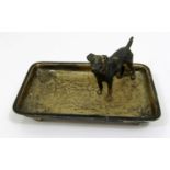 A rectangular silver pin tray surmounted by a hound, the tray dated London 1902, 12.5 cm max