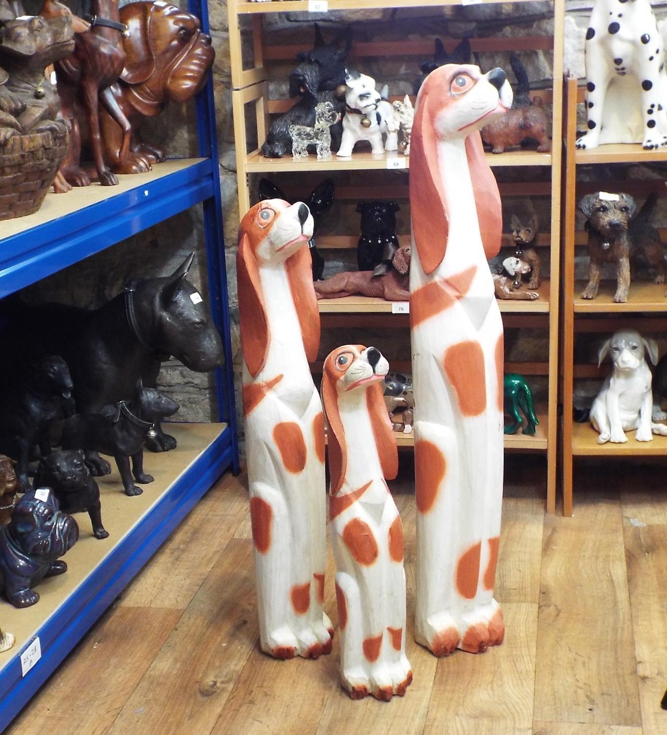 Three amusing carved timber figures of stylised spaniels, 107cm max - Image 3 of 3