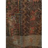 Interesting Bokhara rug with various medallions upon an orange ground, 210 x 110cm