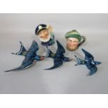 A set of three graduated Beswick wall plaques in the form of flying swallows, with impressed numbers