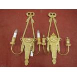 Four classical gilded electric wall lights with ribboned and garland detail, 82 cm in length