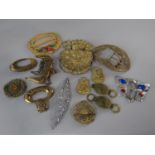 A collection of decorated continental dress wares comprising buckles, brooches and bags